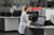 Lab employee working with Struers Duramin hardness tester